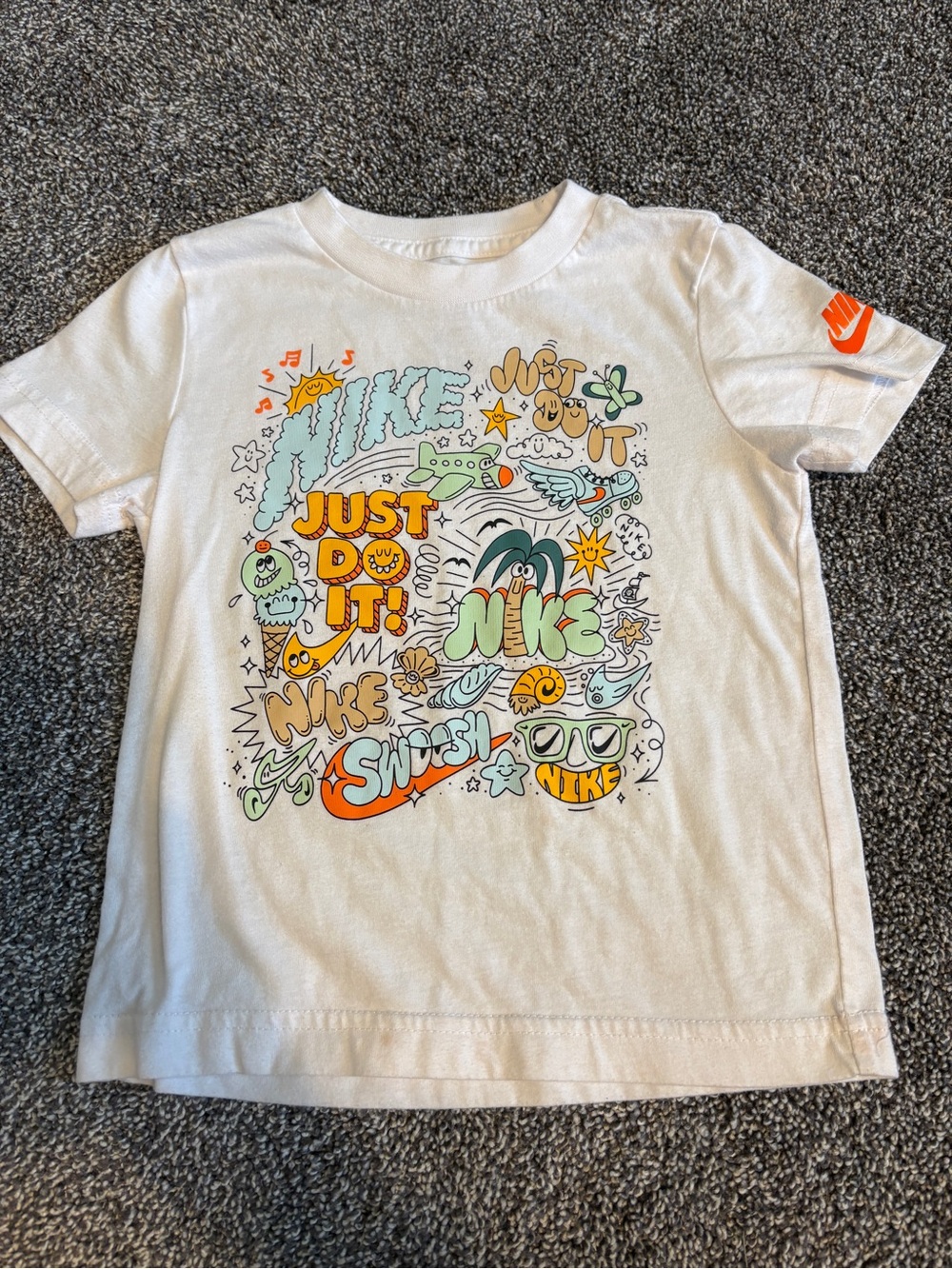 Nike White Short Sleeve Tee with Colorful 'Just Do It' Graphic